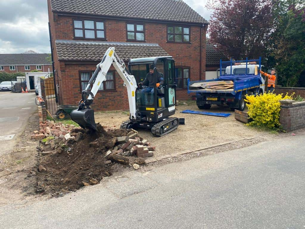 This is a photo of an operative of Lakenheath Driveway Services Digging out for a new tarmac driveway