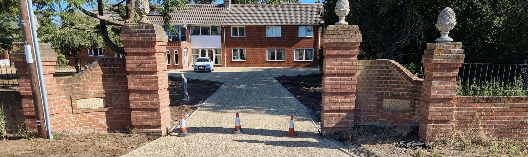 This is a photo of a newly installed chip and tar driveway, installed by Lakenheath Driveway Services